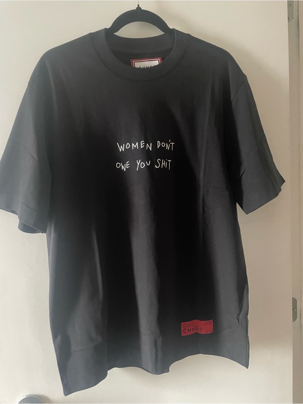 CHNGE Black Tee with White Slogan and Red Logo Patch